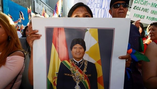 A supporter of Bolivia's President Evo Morales holds a portrait of Morales during a march, in Buenos Aires, Argentina November 8, 2019.