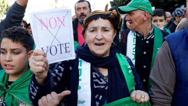 Citizens take part in a protest to demand for the presidential election to be cancelled, in Algiers, Algeria, Dec. 6, 2019.
