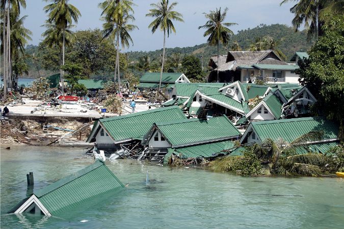 Submerged buildings are seen near the pier at Ton Sai Bay in Thailand's Phi Phi island, December 28, 2004 after a tsunami hit the area.