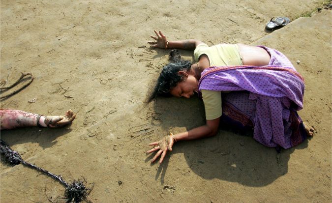 An Indian woman mourns the death of her relative who was killed in a tsunami on Sunday in Cuddalore, south of the southern Indian city of Madras, December 28, 2004.