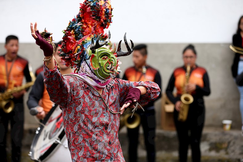 A devil dances to the music of village bands, Pillaro, Ecuador, January 3, 2020.
