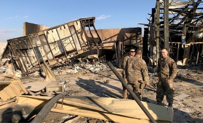 U.S. soldiers are seen at the site where an Iranian missile hit at Ain al-Asad air base in Anbar province, Iraq.