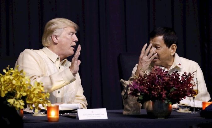 U.S. President Trump talks with Philippines President Rodrigo Duterte during the gala dinner marking ASEAN's 50th anniversary in Manila, Philippines.