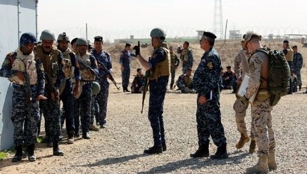 Iraqi federal policemen receive military instructions by Spanish military trainers during a course by NATO forces, at Basmaya military base, 65km southern Baghdad, Iraq, 12 March 2018. 