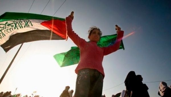 A man waves the Palestinian flag in the occupied West Bank
