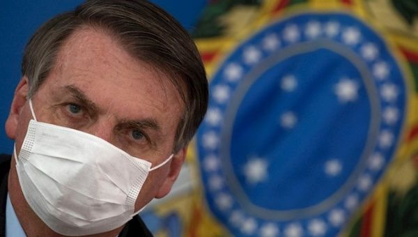 President Jair Bolsonaro during a press conference, after meeting with ministers at the Planalto Palace, on the measures adopted by the government against the expansion of the coronavirus, this Wednesday, in Brasilia