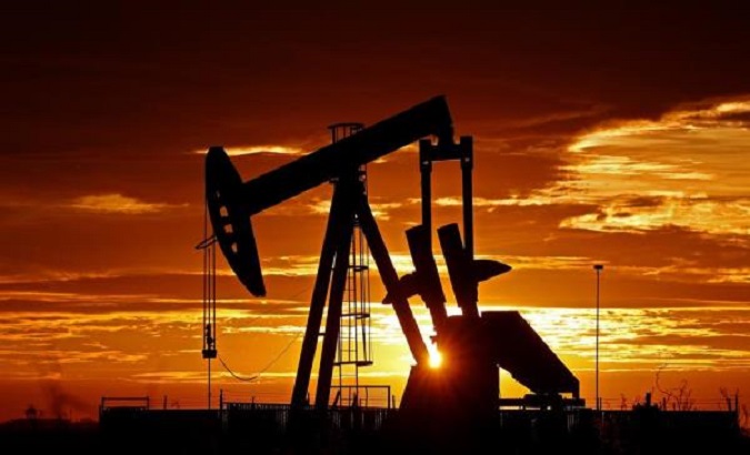 An oil pump in operation at dawn near the Texan town of Midland, United States, April, 2020.