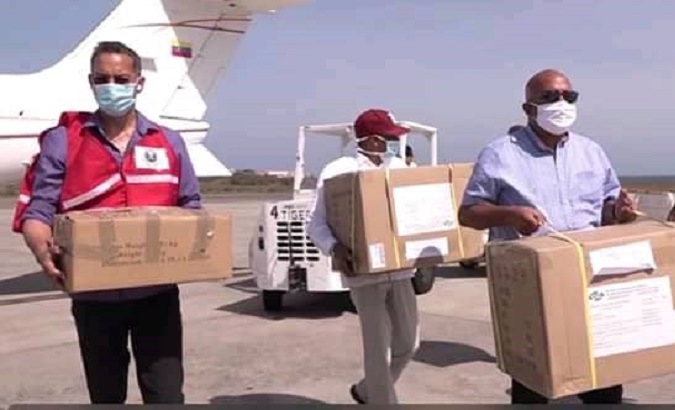 Venezuelan aid workers begin to land health supplies in St. George, Grenada, April 11, 2020.