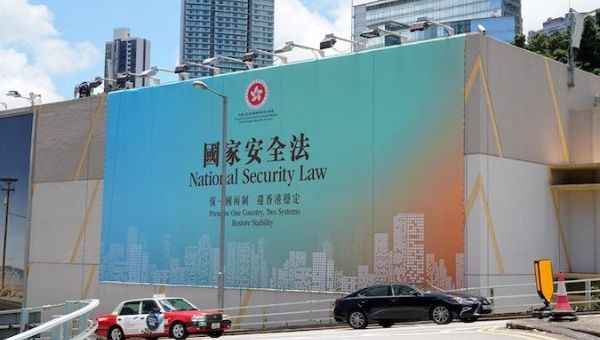 A public service advertisement supporting national security law hangs on the wall of a building on Cotton Tree Drive in Hong Kong, China, June 11, 2020.