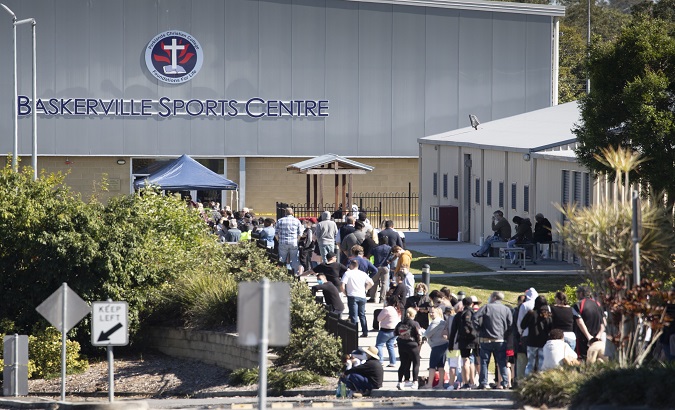 People arrive at a COVID-19 screening clinic at the Parklands Christian College in Brisbane, Australia, July 30, 2020.
