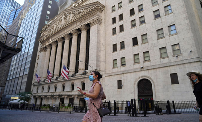 Tourists outside the New York Stock Exchange, New York, U.S., August 2, 2020.