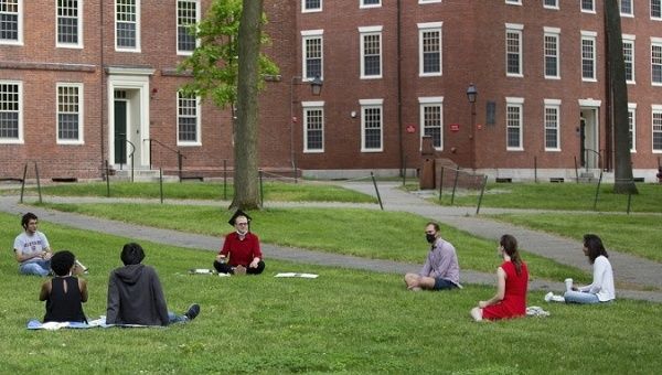 Students talks while meet distancing requirements at Harvard College, Massachusets, U.S., July 8, 2020.