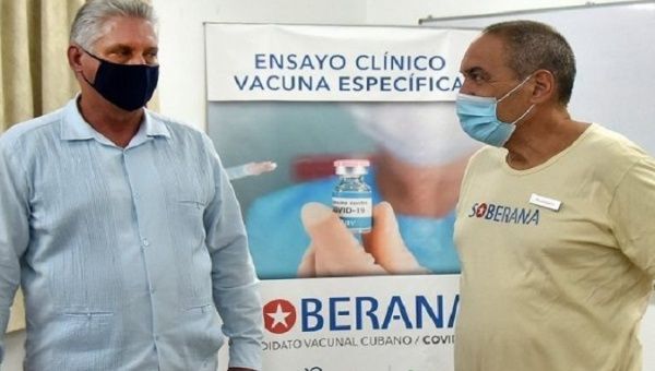 President Miguel Diaz-Canel Bermudez (L) and the Finlay Institute of Vaccines (R) Vicente Verez, Havana, Cuba. Oct. 3, 2020.