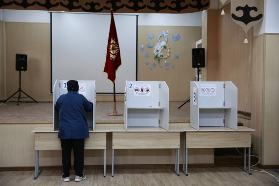 A person prepares to vote at a polling station in Bishkek, Kyrgyzstan on Oct. 4, 2020.