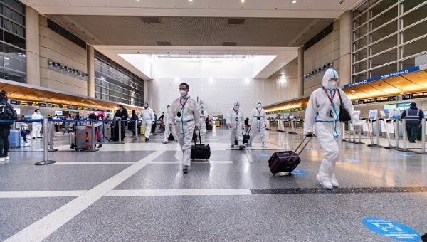 Airline crew members wear full hazmat suits as they arrive at LAX Tom Bradley International Airport amid COVID-19 pandemic in Los Angeles, California, the United States, 24 November 2020. 