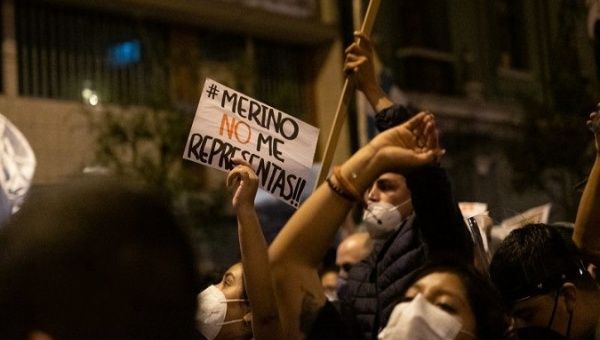 Protesters call for the resignation of then-President Manuel Merino, Lima, Peru, Nov. 12, 2020. The sing reads, 