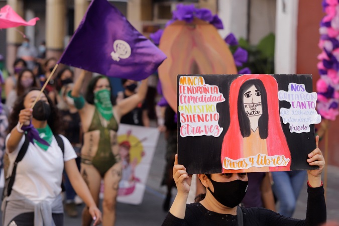 Activists march on December 5 on Puebla to demand the respect to women's rights.