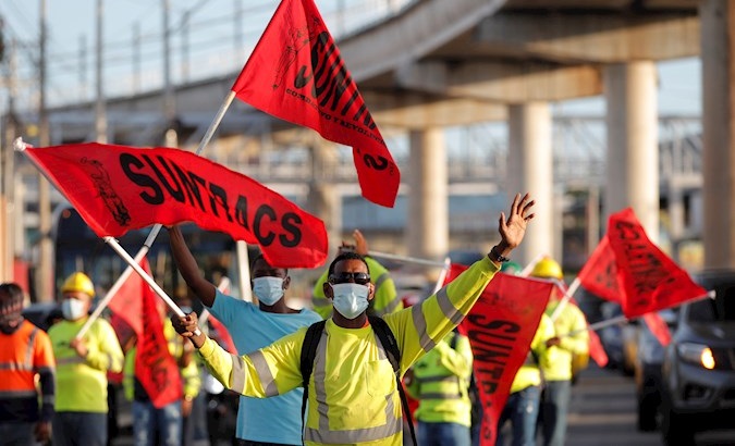 Construction workers protest on the streets of Panama city, Panama. Dec. 29, 2020.