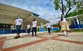 Students attend the inauguration of the "Mango Plan" school, San Salvador, El Salvador, 2020.