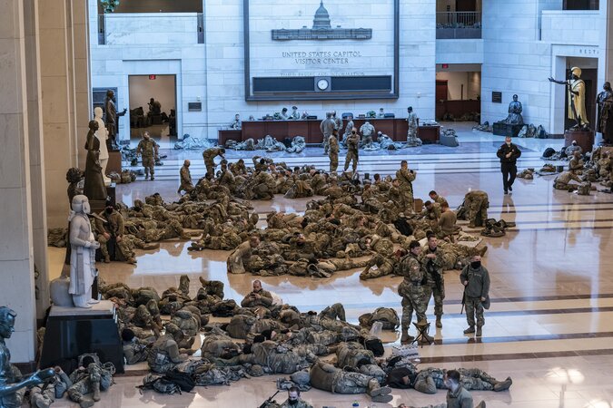 Hundreds of National Guard troops nap inside the US Capitol Visitor Center as the House prepares to debate on an article of impeachment against President Trump. Washington, DC, USA. January 13, 2021.⁠