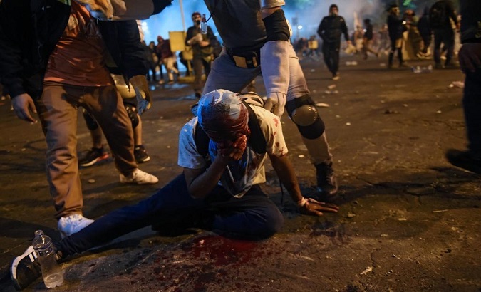 Anti-riot police injured a protester, Lima, Peru, Nov. 15, 2020.