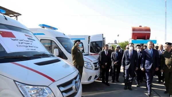 China's Ambassador to Iraq Zhang Tao (3rd R, Front) and Iraqi Interior Ministry Deputy Minister Hussein al-Awadi (2nd R, Front) inspect the donated ambulances, Baghdad, Iraq, on Jan. 21, 2021.