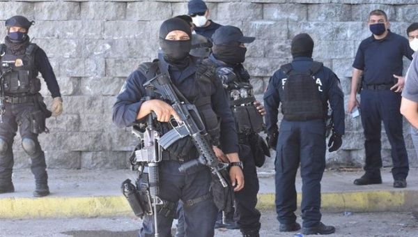 Officers carry out a police operation, Mexico, 2020.