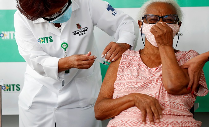 An elderly person receives the first dose of the Coronavac vaccine, Sao Paulo, Brazil, Feb. 5, 2021.