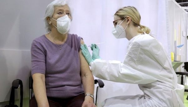 Woman receives a vaccine at the 'Velodrom' stadium, Berlin, Germany, Feb. 17, 2021. 