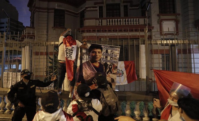 Protesters violate perimeter of Venezuelan embassy in Lima, Peru, Feb. 20, 2021.