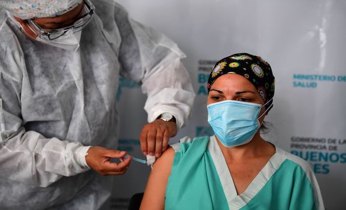 A nurse receives one shot of the Sputnik V vaccine, Asuncion, Paraguay, Feb. 22, 2021.