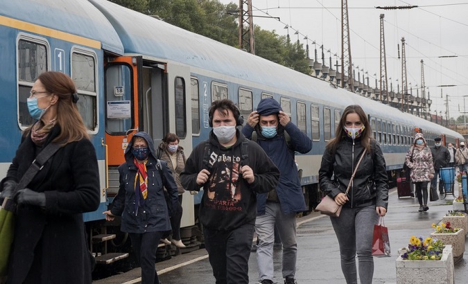People wearing face masks are seen at a railway station in Budapest, Hungary, Oct. 14, 2020.