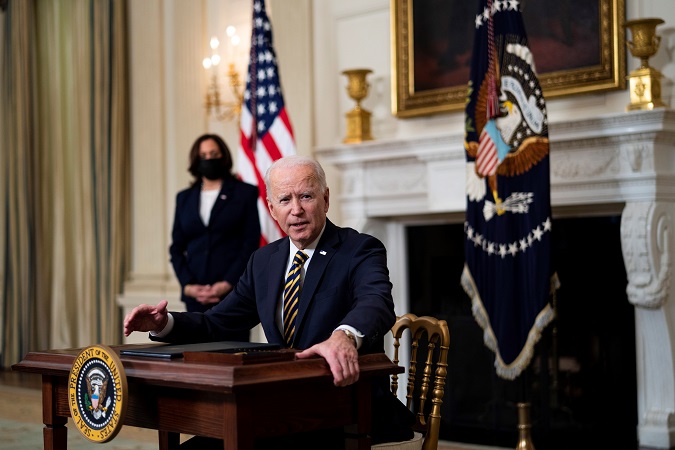 US President Joe Biden signs an Executive Order on the economy with US Vice President Kamala Harris (L) in the State Dining Room of the White House, in Washington, DC, USA, 24 February 2021.