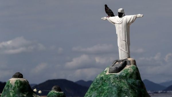 A view of a statue of Christ the Redeemer with a mask, in Rio de Janeiro. Brazil accumulates a total of 10,718,630 Covid-19 infections, with 259,271 deaths.