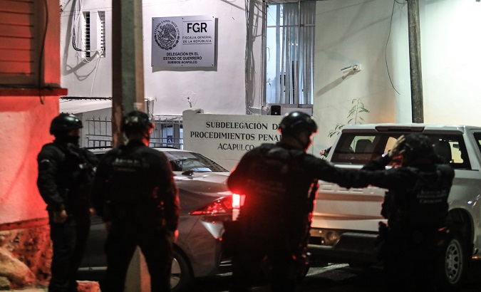 Police officers transfer Puebla's ex-governor to the Attorney General's Office in Acapulco, Mexico, Feb. 3, 2021.