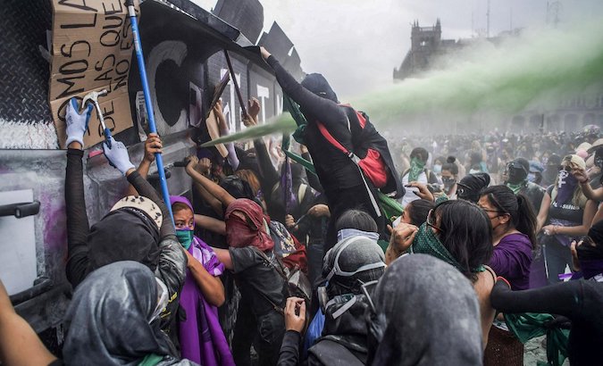 Women protest outside the National Palace, Mexico City, Mexico, March 8, 2021.