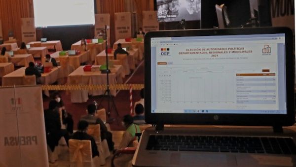 Election staff monitors the vote count from a computer, La Paz, Bolivia, March 7, 2021.