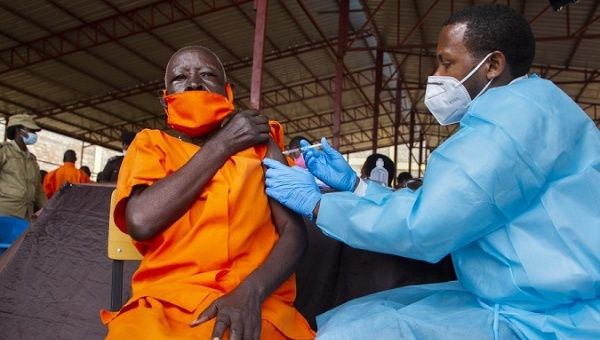 An inmate receives a COVID-19 vaccine at Nyarugenge prison, Kigali, Rwanda, March 9, 2021. 