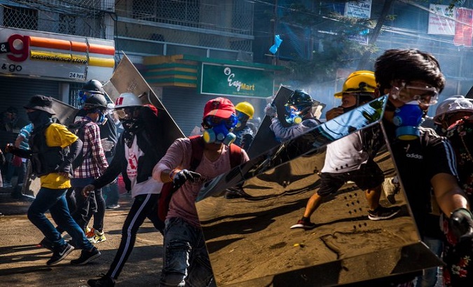 Citizens using home-made shields to face police brutal repression, Myanmar, March 14, 2021.