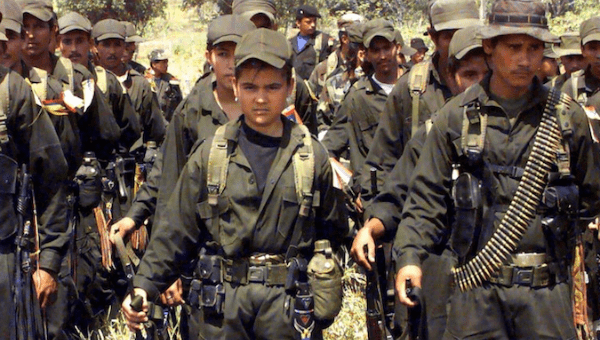 A child soldier (C) in an irregular armed group, Los Pozos, Colombia.