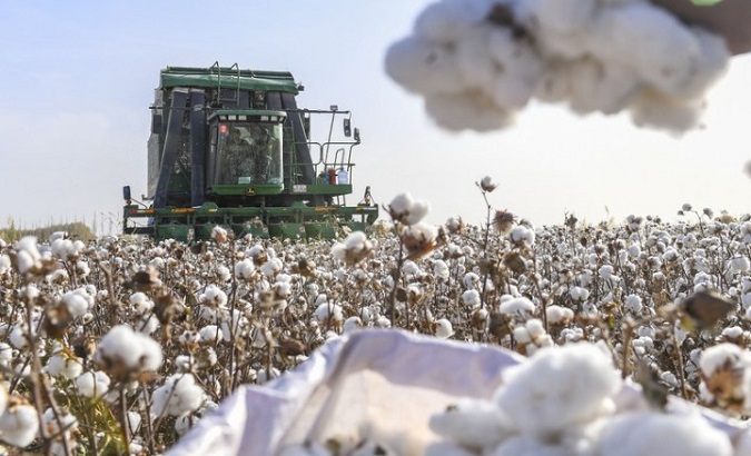 A picking machine moves in a cotton field in Dolatbag Town, Xinjiang, China, Oct. 30, 2018.