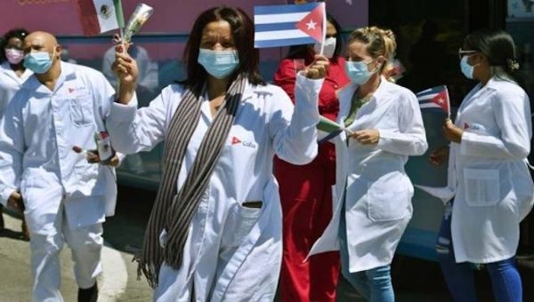 Doctors wave a Cuban flag in Havana, Cuba, January 22, 2021.