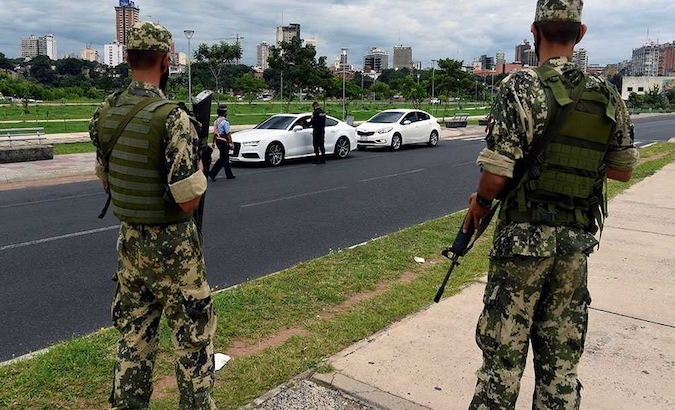 Military personnel patrol a street in Asuncion, Paraguay, April 2021, 2021.