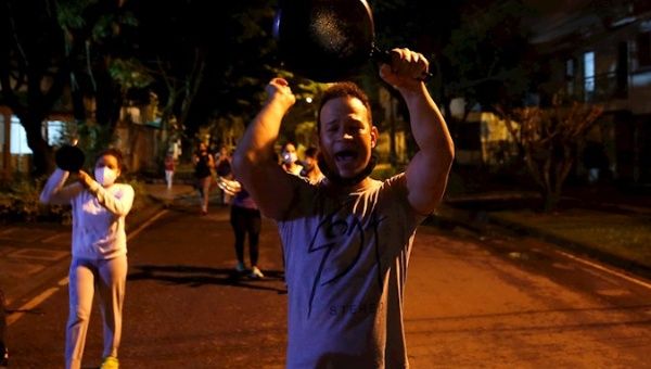 A man hits a saucepan today, during a protest against the tax reform proposed by the government of Colombian President Iván Duque in Cali (Colombia)