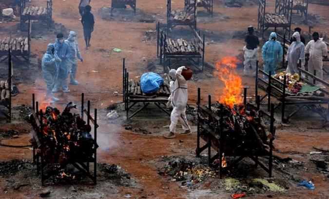 Funeral at a mass cremation ground in Bangalore, India, May 3, 2021.