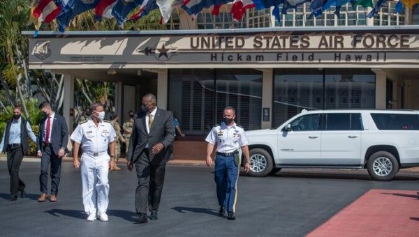 U.S. Secretary of Defense Lloyd Austin visiting a U.S. Air Force base in Hawaii to discuss 