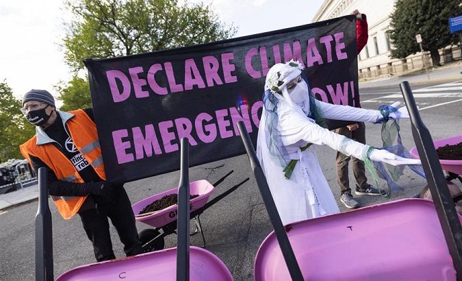 Extinction Rebellion activists protest near the White House, Washington, DC, U.S., April 22, 2021.