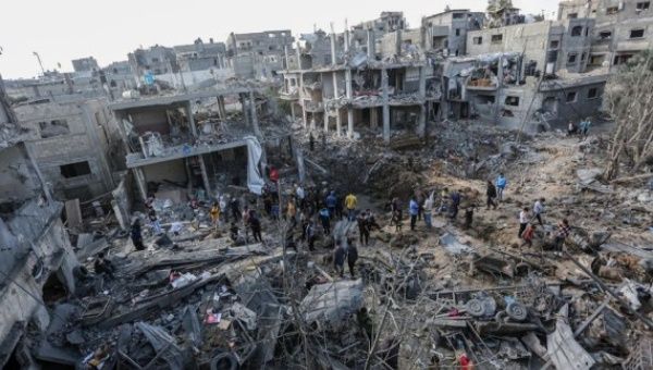 Palestinians inspect their destroyed houses in the northern Gaza Strip town of Beit Hanoun, on May 14, 2021.