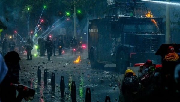Protesters clash with riot police in Medellin, Colombia, May 29, 2021.