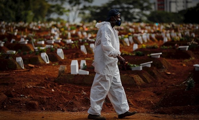 Worker prepares to receive more COVID-19 victims, Vila Formosa Cemetery, Sao Paulo, Brazil, May 28, 2021.